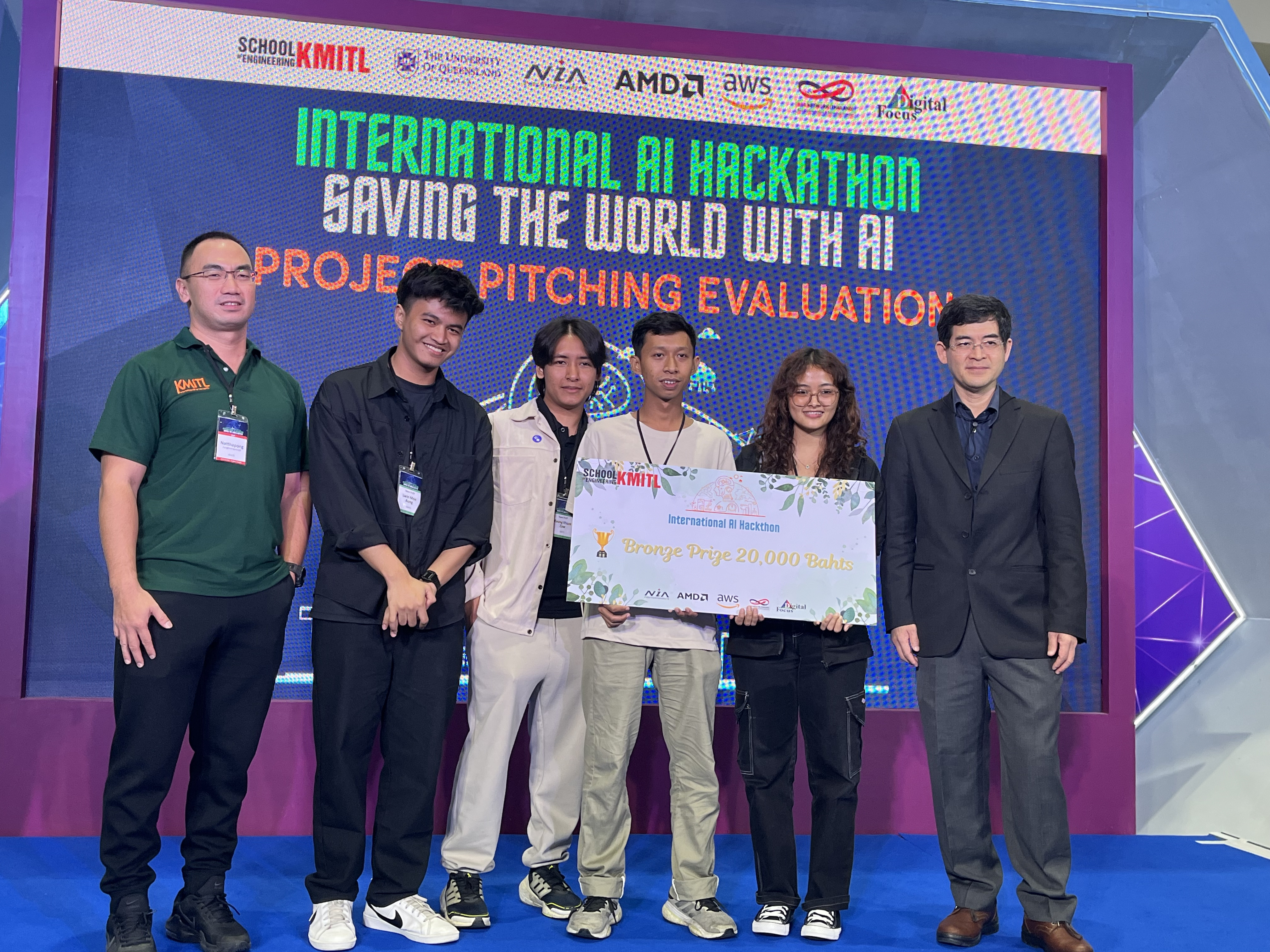 Hackathon team on stage holding the Bronze Prize board